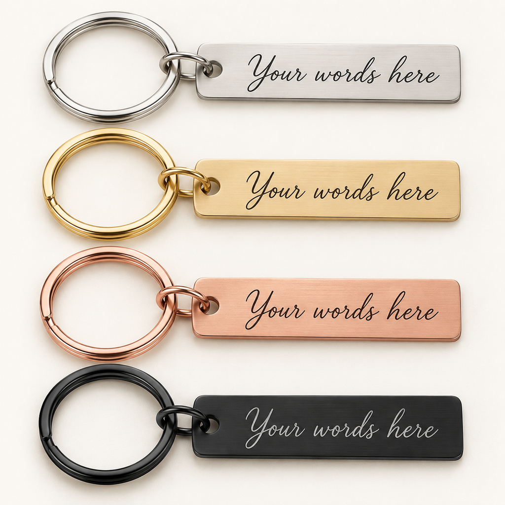 Illustrative personalised bar keyring finishes: Silver, Gold, Rose Gold and Black