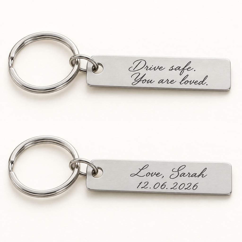 Illustrative front and back views of one silver bar keyring with example two-sided engraving